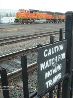 CAUTION WATCH FOR MOVING TRAINS